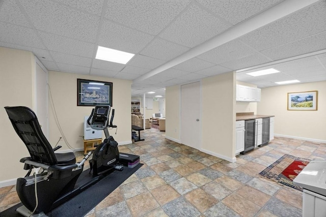 21 Gramps Way, Chatham, MA 02659 - workout room featuring wine cooler, stone tile flooring, a paneled ceiling, and bar