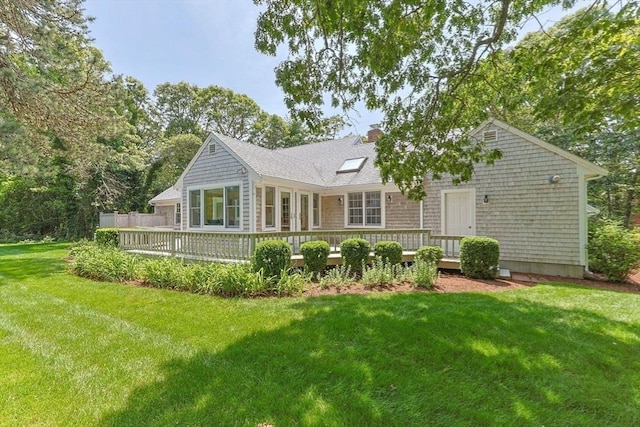 21 Gramps Way, Chatham, MA 02659 - rear view of property featuring a wooden deck, a yard, and a chimney
