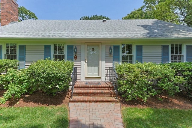 21 Gramps Way, Chatham, MA 02659 - view of front of home with roof with shingles and a chimney