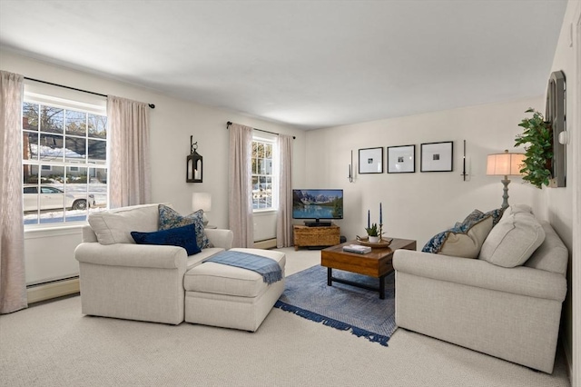 carpeted living room with a baseboard radiator