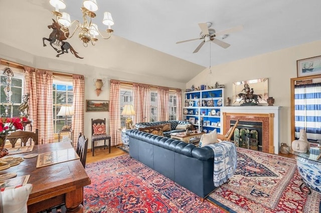 1 Carter Ave, Salisbury, MA 01952 - living area featuring a chandelier, a ceiling fan, wood finished floors, a fireplace, and lofted ceiling
