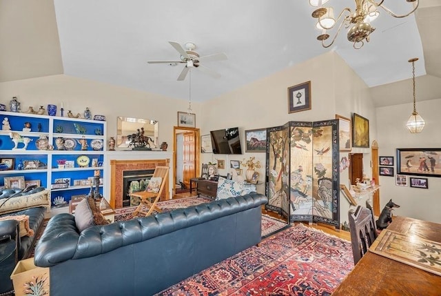 1 Carter Ave, Salisbury, MA 01952 - living room with ceiling fan, a glass covered fireplace, a chandelier, lofted ceiling, and wood finished floors