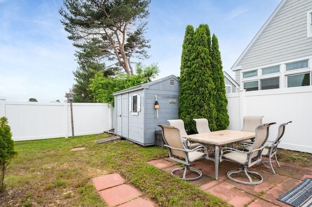 1 Carter Ave, Salisbury, MA 01952 - fenced backyard with a shed, outdoor dining area, and a patio area