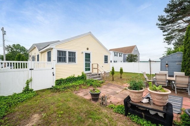 1 Carter Ave, Salisbury, MA 01952 - back of house with a gate, a patio area, and outdoor dining space