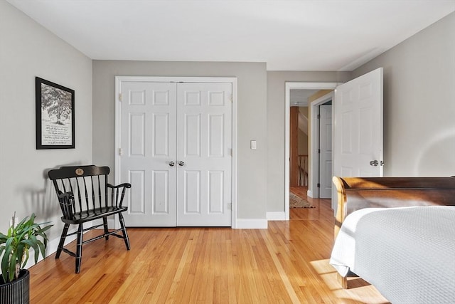 bedroom with a closet and light wood-type flooring