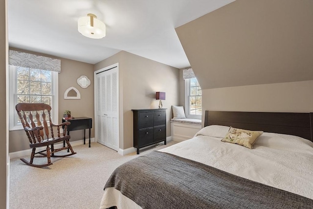 bedroom featuring a closet and light carpet