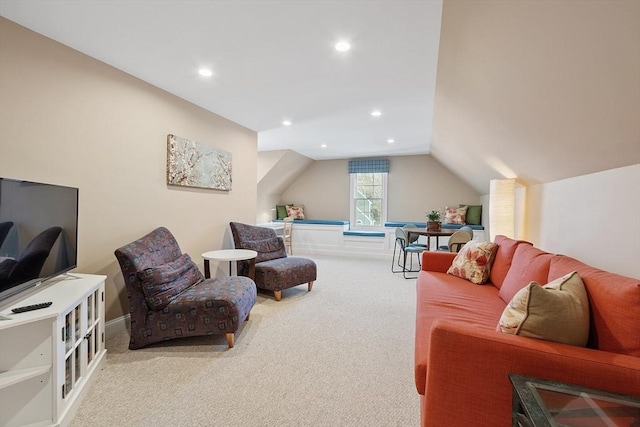 living room featuring lofted ceiling and carpet floors