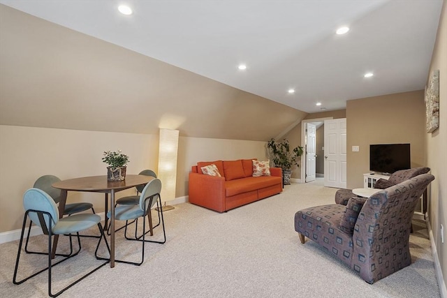 living room with lofted ceiling and light carpet