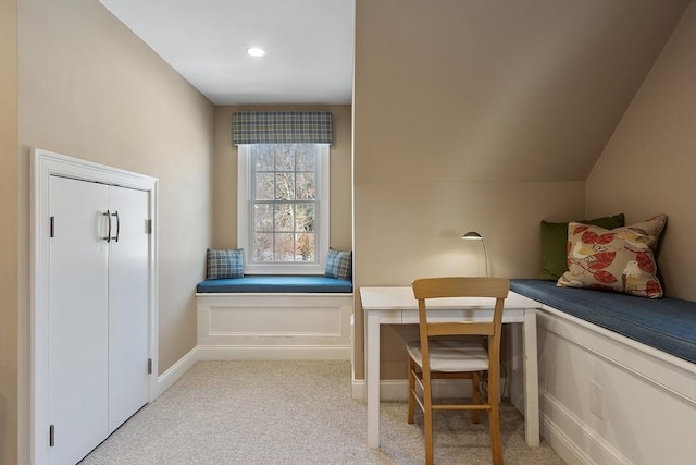 sitting room featuring light carpet