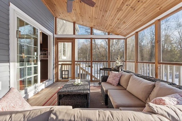 sunroom with ceiling fan, wooden ceiling, and lofted ceiling