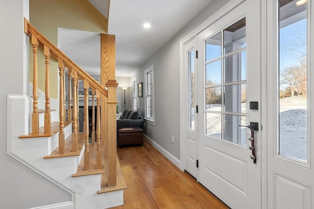 entrance foyer with light hardwood / wood-style floors and plenty of natural light