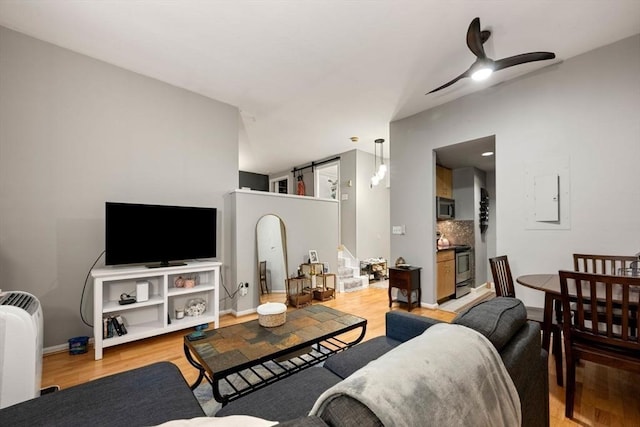 350 W 4th St Unit 103, Boston, MA 02127 - living area with wood finished floors, ceiling fan, and electric panel