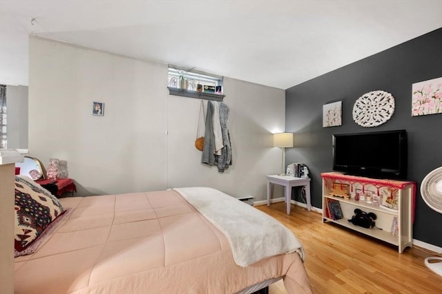 350 W 4th St Unit 103, Boston, MA 02127 - bedroom with wood finished floors, multiple windows, and baseboards