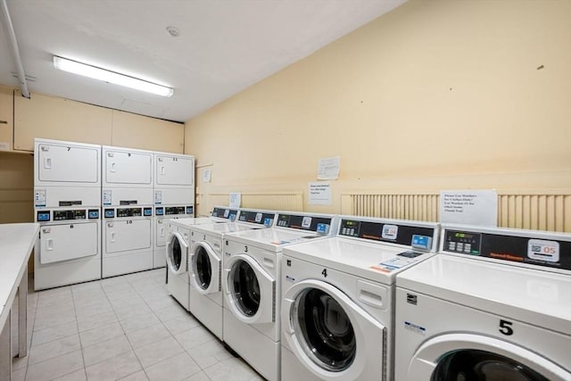 350 W 4th St Unit 103, Boston, MA 02127 - shared laundry with estacked washer and dryer, washer and clothes dryer, and light tile patterned flooring
