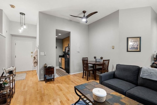 350 W 4th St Unit 103, Boston, MA 02127 - living area featuring light wood-type flooring, a ceiling fan, and baseboards