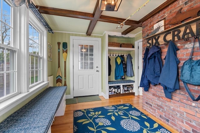 mudroom featuring crown molding, brick wall, wood finished floors, beamed ceiling, and coffered ceiling