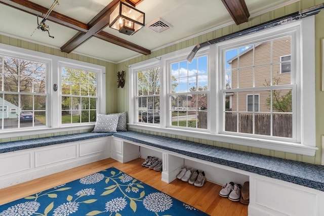 unfurnished sunroom with visible vents, coffered ceiling, and beamed ceiling