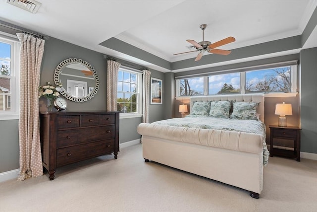bedroom featuring baseboards, crown molding, and light colored carpet