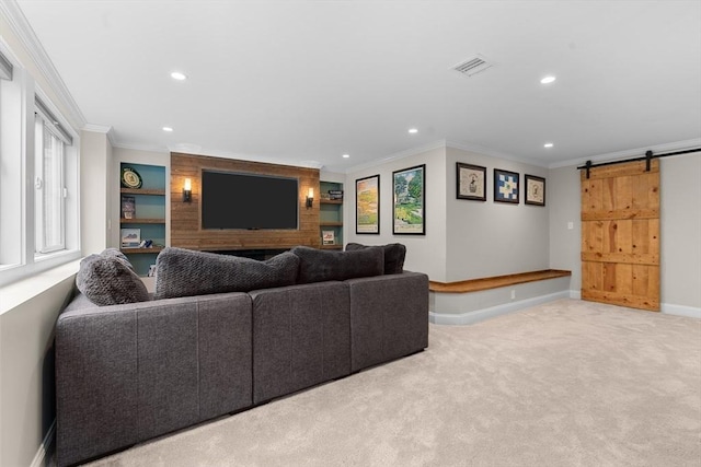 carpeted living area with visible vents, ornamental molding, baseboards, recessed lighting, and a barn door