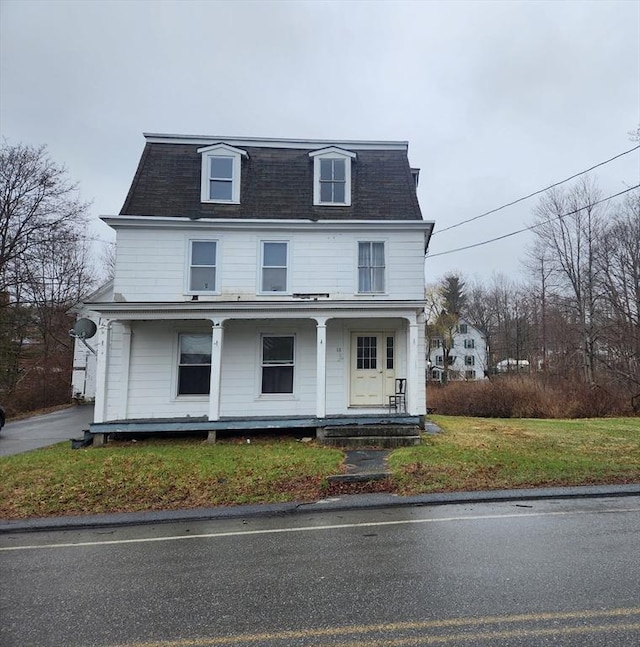 18 Central St, Ashburnham, MA 01430 - second empire-style home featuring mansard roof, covered porch, and roof with shingles