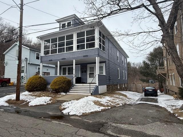 view of front facade featuring a sunroom