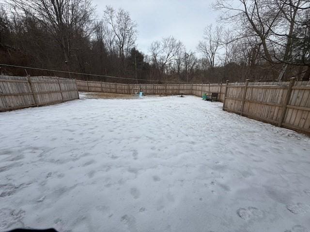 view of yard layered in snow