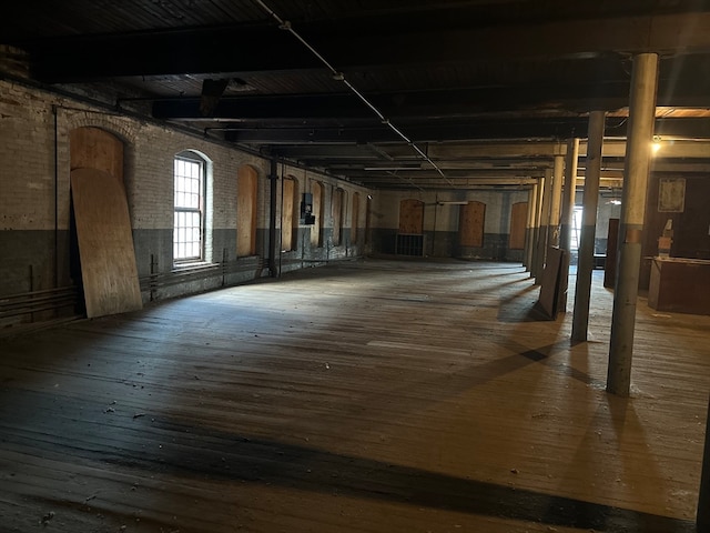 miscellaneous room featuring wood-type flooring and electric panel