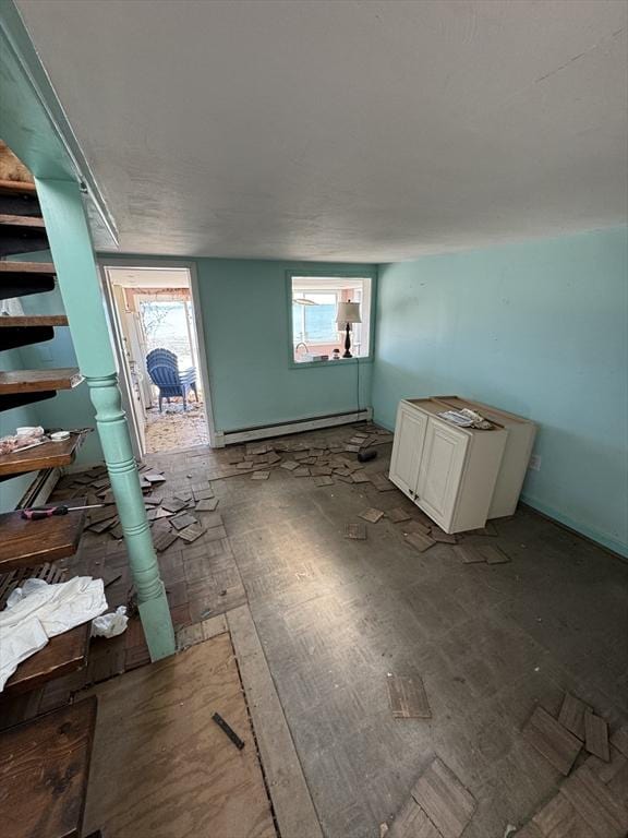 10 Nut Island Ave, Quincy, MA 02169 - spare room featuring baseboard heating and healthy amount of natural light