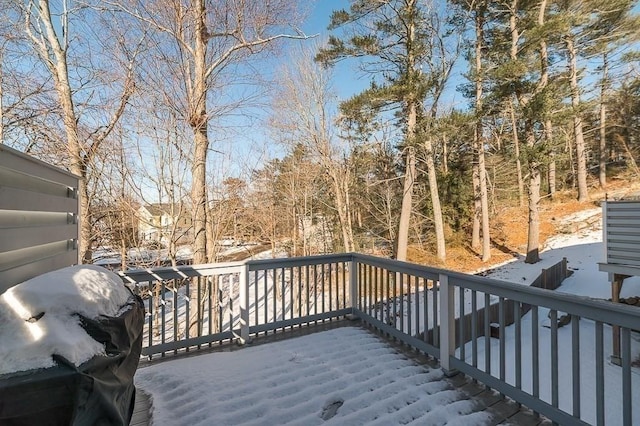 snow covered deck featuring area for grilling