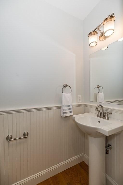 bathroom with hardwood / wood-style flooring