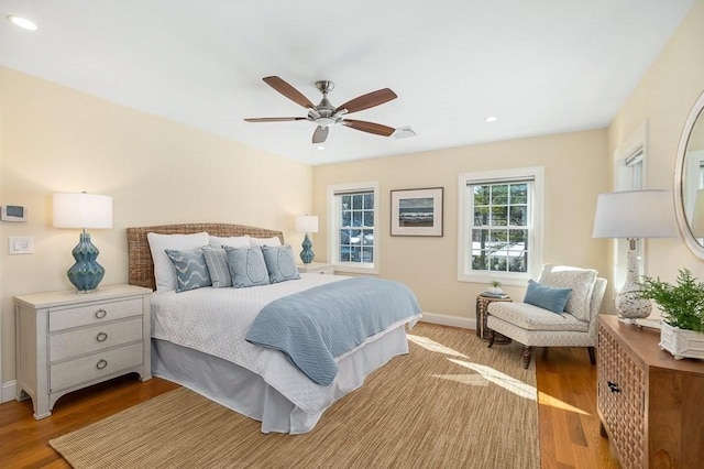 bedroom with ceiling fan and light wood-type flooring