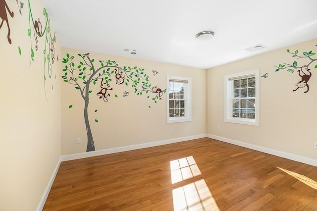 spare room featuring hardwood / wood-style floors