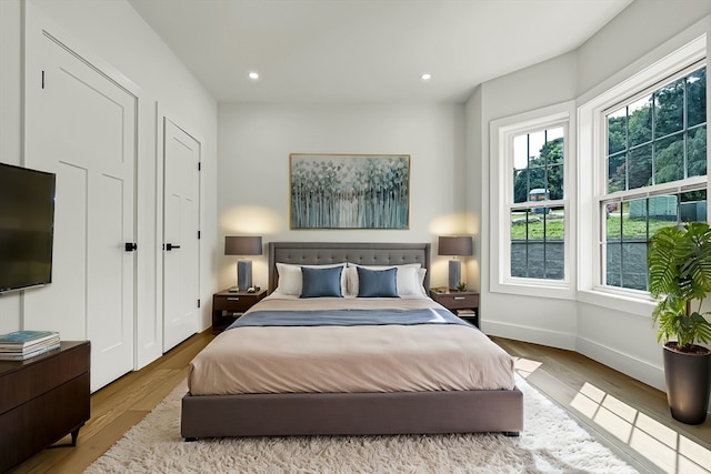 bedroom with light hardwood / wood-style floors