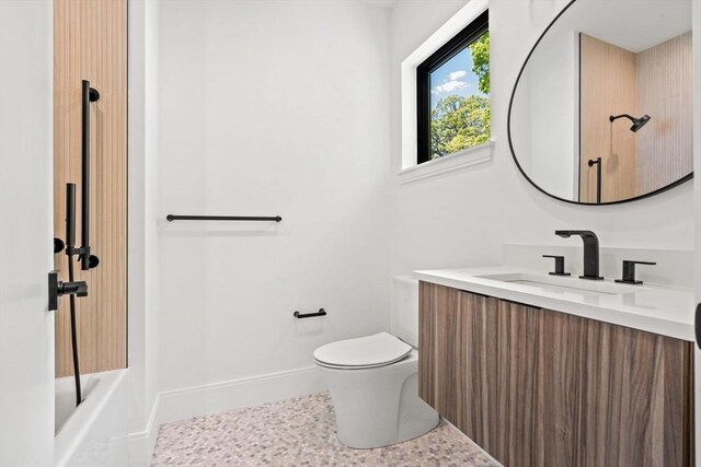 17 Prospect Hill Rd, Lexington, MA 02420 - bathroom with vanity, toilet, and baseboards