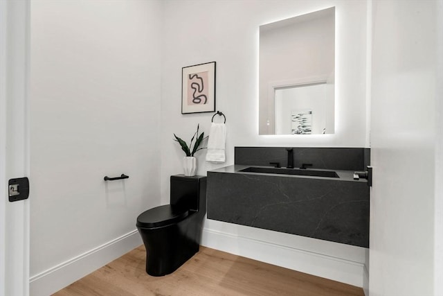 17 Prospect Hill Rd, Lexington, MA 02420 - bathroom with a sink, toilet, wood finished floors, and baseboards