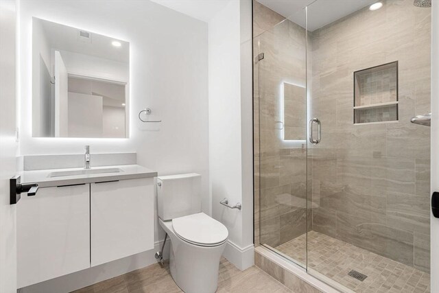 17 Prospect Hill Rd, Lexington, MA 02420 - bathroom with vanity, a stall shower, toilet, and baseboards