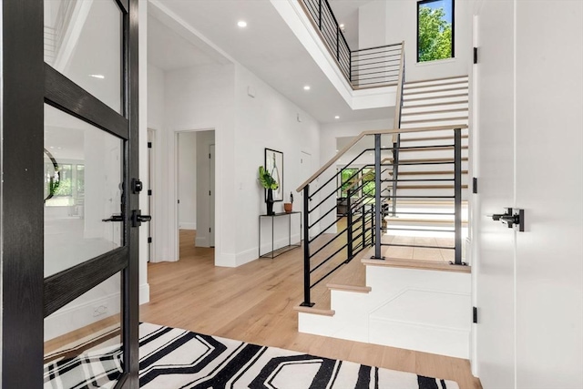 17 Prospect Hill Rd, Lexington, MA 02420 - foyer entrance featuring a high ceiling, stairs, wood finished floors, baseboards, and recessed lighting