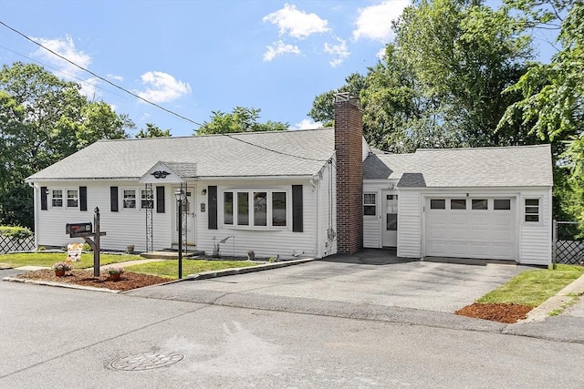 8 Janis Ter, Woburn, MA 01801 - view of front facade with driveway, a chimney, a garage, and roof with shingles