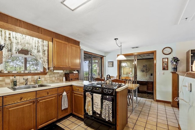8 Janis Ter, Woburn, MA 01801 - kitchen featuring black range with electric cooktop, light tile patterned floors, decorative backsplash, and light countertops