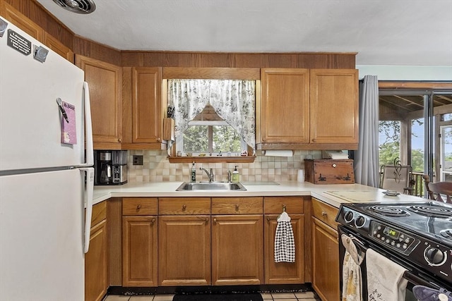 8 Janis Ter, Woburn, MA 01801 - kitchen with freestanding refrigerator, black electric range oven, healthy amount of natural light, and tasteful backsplash