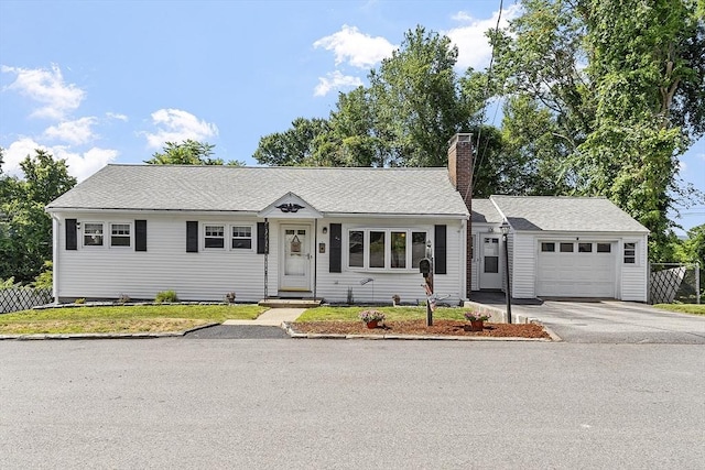 8 Janis Ter, Woburn, MA 01801 - single story home featuring an attached garage, a chimney, driveway, and a front lawn