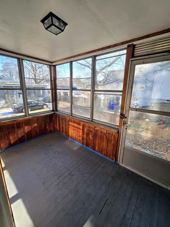 unfurnished sunroom with a healthy amount of sunlight