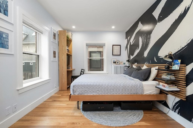 bedroom featuring recessed lighting, light wood finished floors, and baseboards
