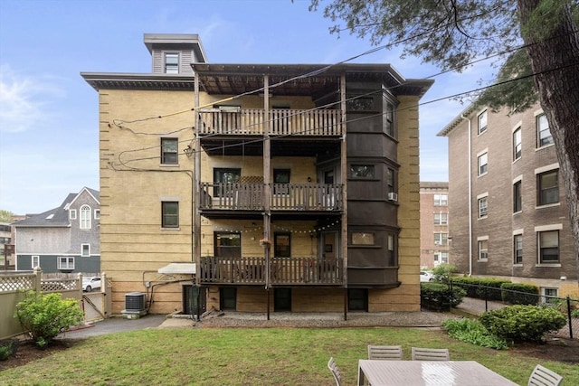 view of property with fence and central air condition unit