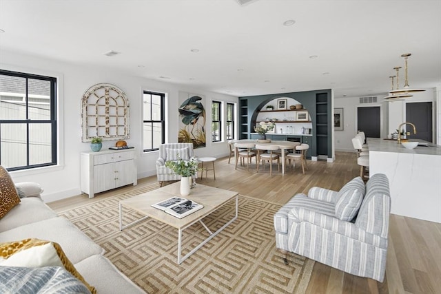361 Walden Unit 361, Cambridge, MA 02138 - living area featuring light wood-style flooring and built in features