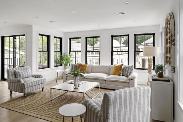 361 Walden Unit 361, Cambridge, MA 02138 - living room with plenty of natural light, light wood-style floors, and recessed lighting