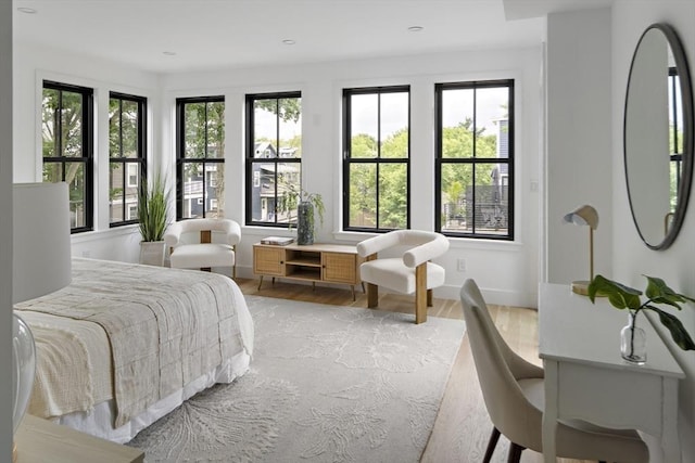 361 Walden Unit 361, Cambridge, MA 02138 - bedroom featuring light wood finished floors, multiple windows, and recessed lighting