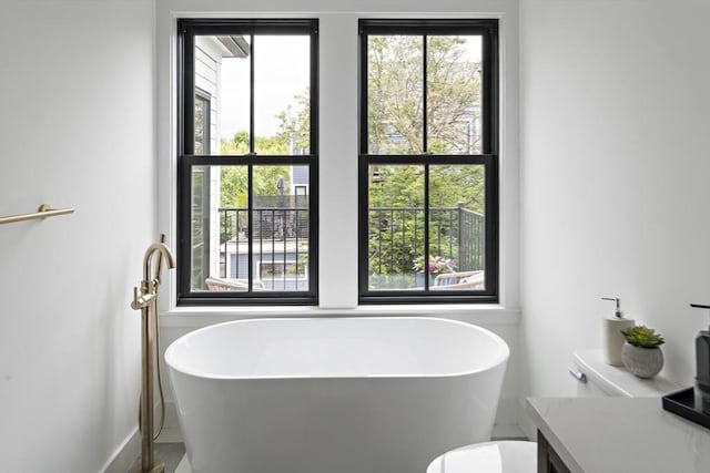 361 Walden Unit 361, Cambridge, MA 02138 - full bathroom with a freestanding tub and healthy amount of natural light