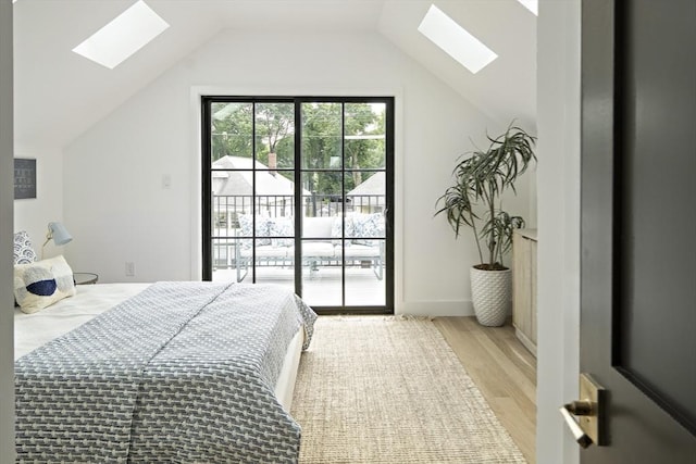 361 Walden Unit 361, Cambridge, MA 02138 - bedroom featuring a skylight, access to outside, light wood-type flooring, and lofted ceiling