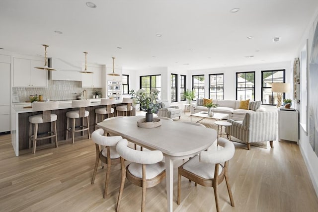 361 Walden Unit 361, Cambridge, MA 02138 - dining space featuring healthy amount of natural light, light wood-style floors, and recessed lighting